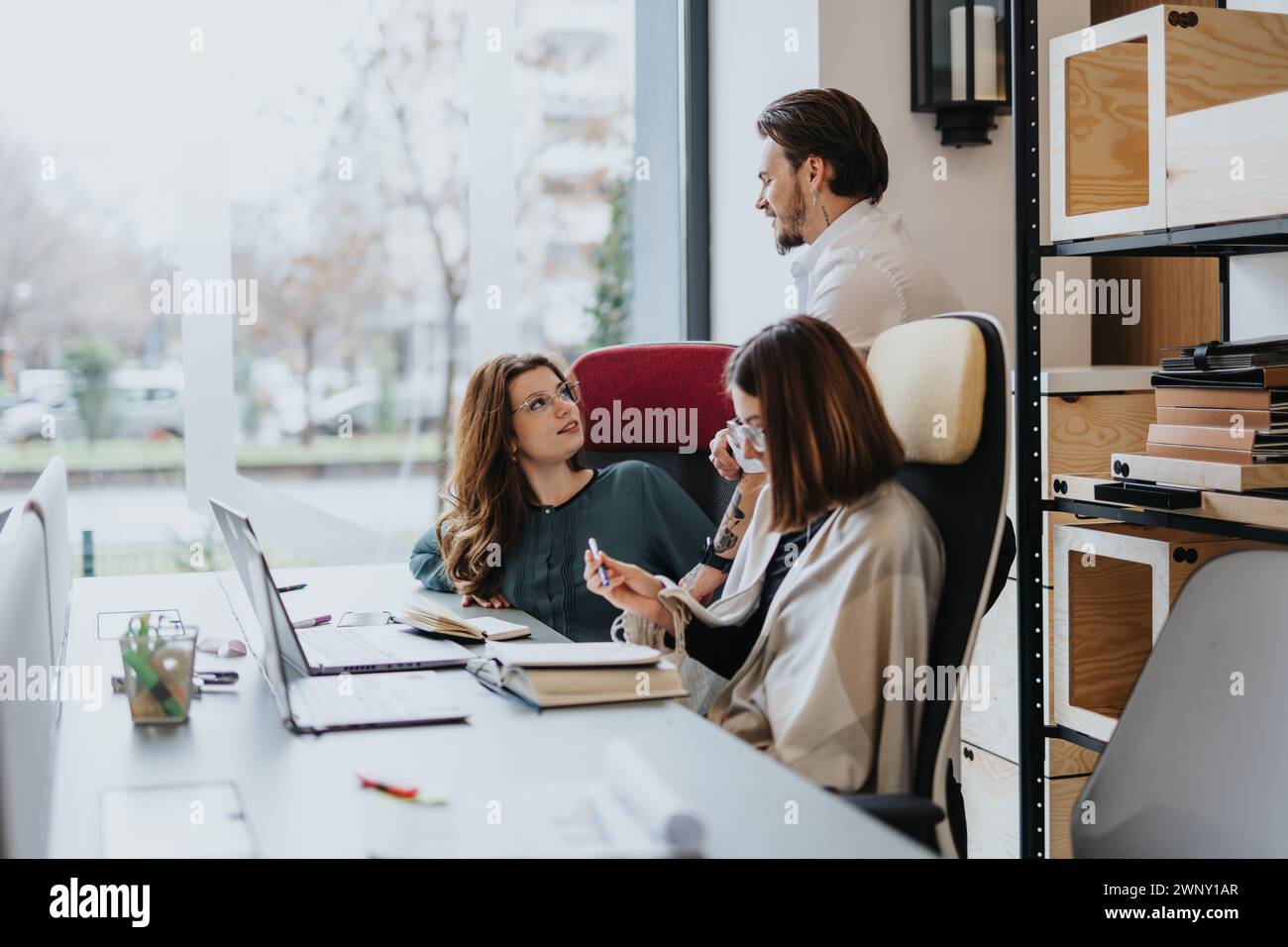 Successful young entrepreneurs collaborating in a modern office Stock ...