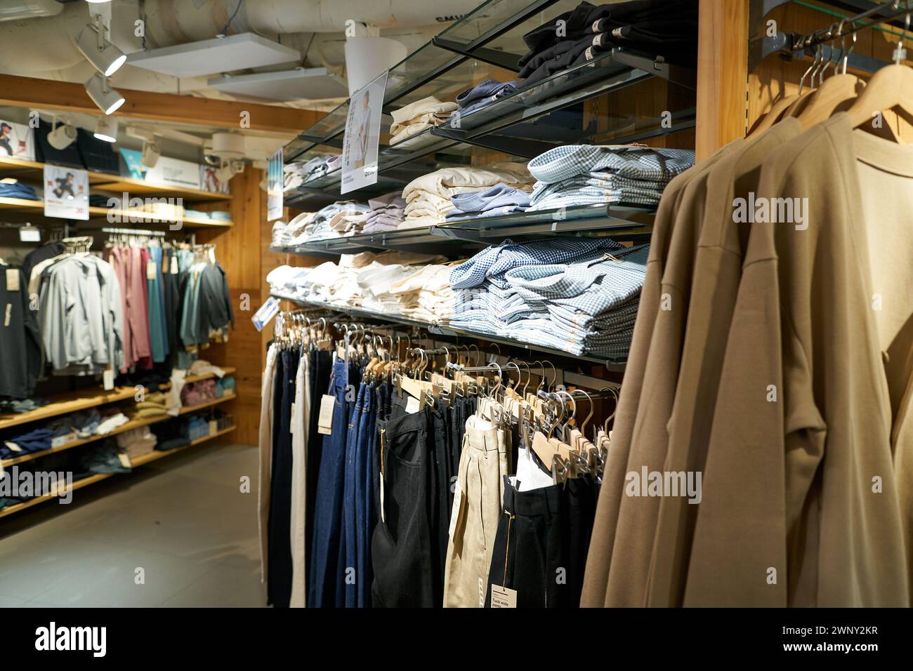 HONG KONG, CHINA - DECEMBER 04, 2023: various apparel displayed at Muji ...