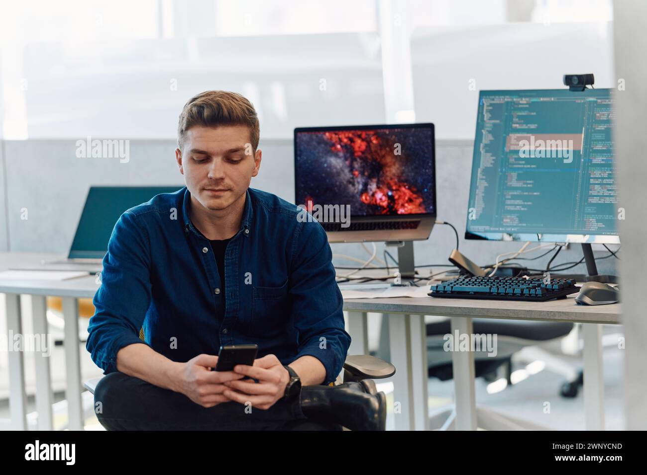 Programming. Man Working On Computer In IT Office, Sitting At Desk Writing Codes. Programmer Typing Data Code, Working On Project In Software Stock Photo