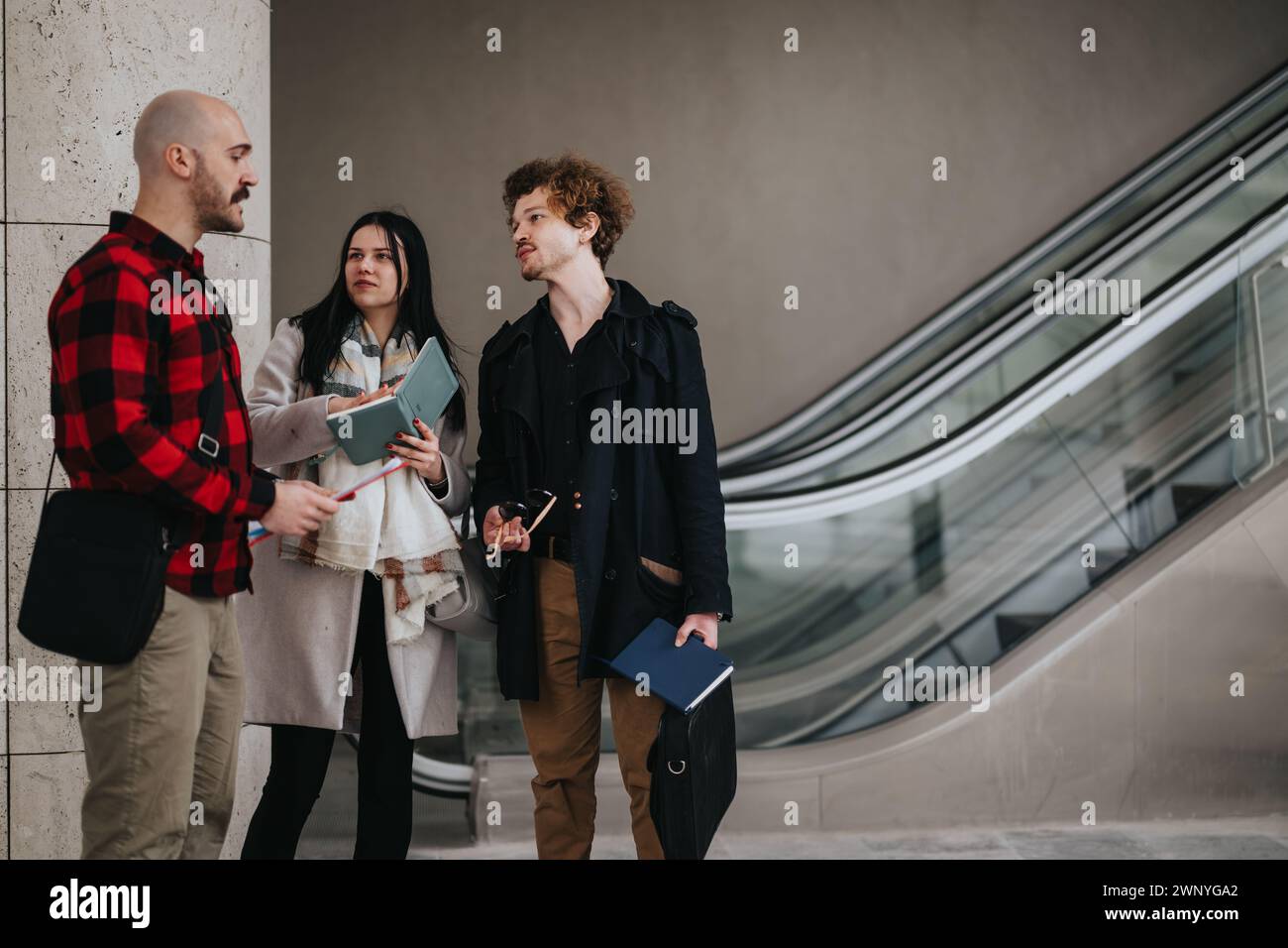 Business colleagues in an informal meeting outdoors discussing strategies Stock Photo