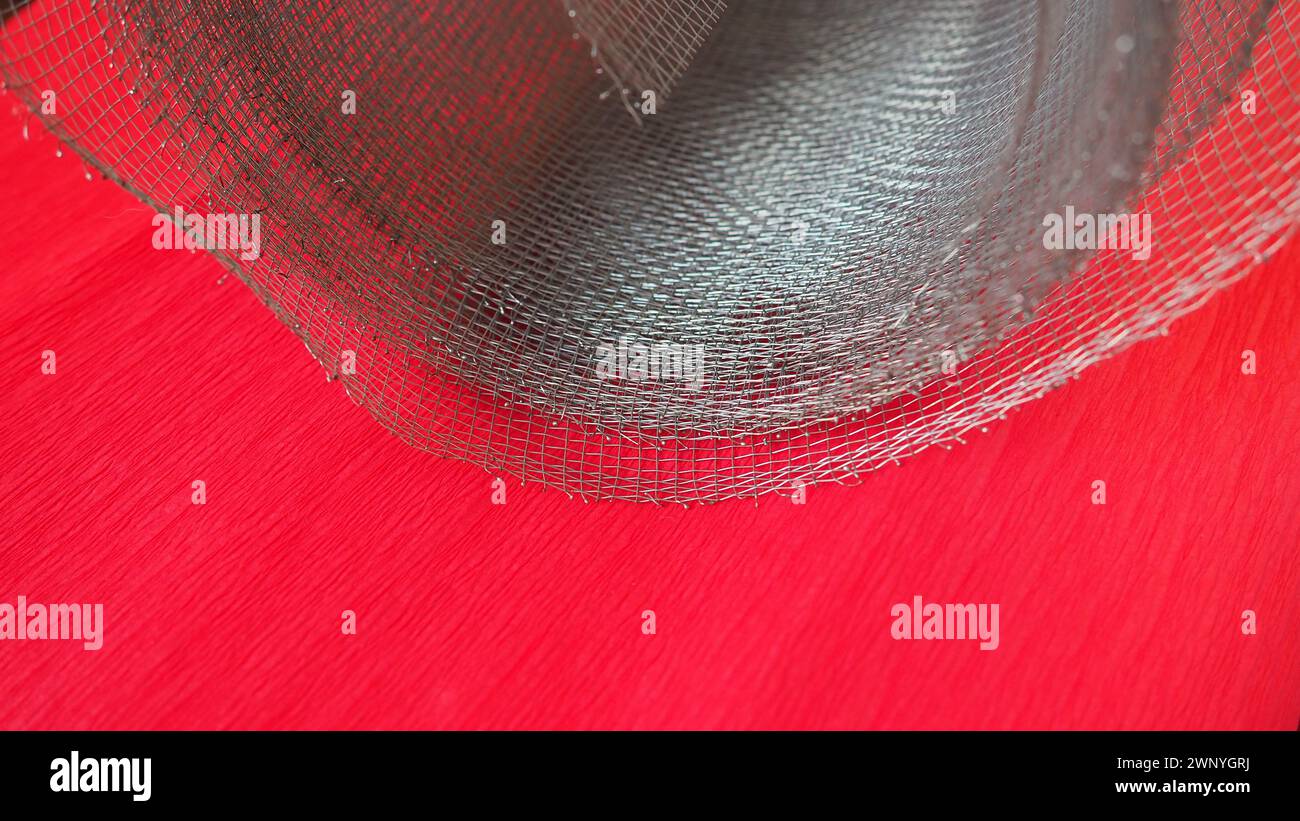 Metal mesh. Rolled mesh in gray. Heavy duty steel or aluminum mesh with