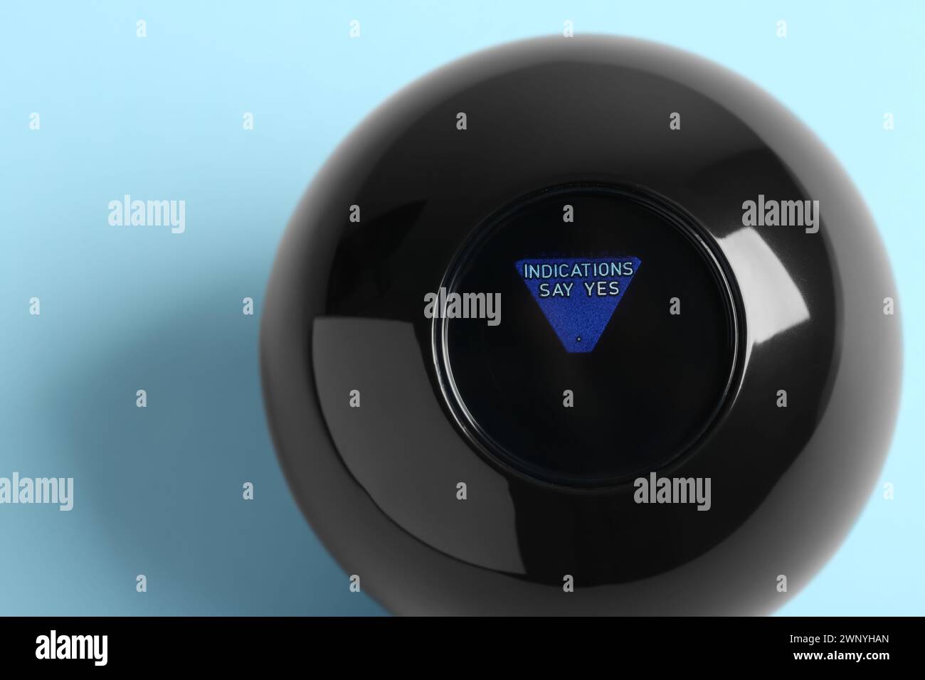 Magic eight ball with prediction Indications Say Yes on light blue ...