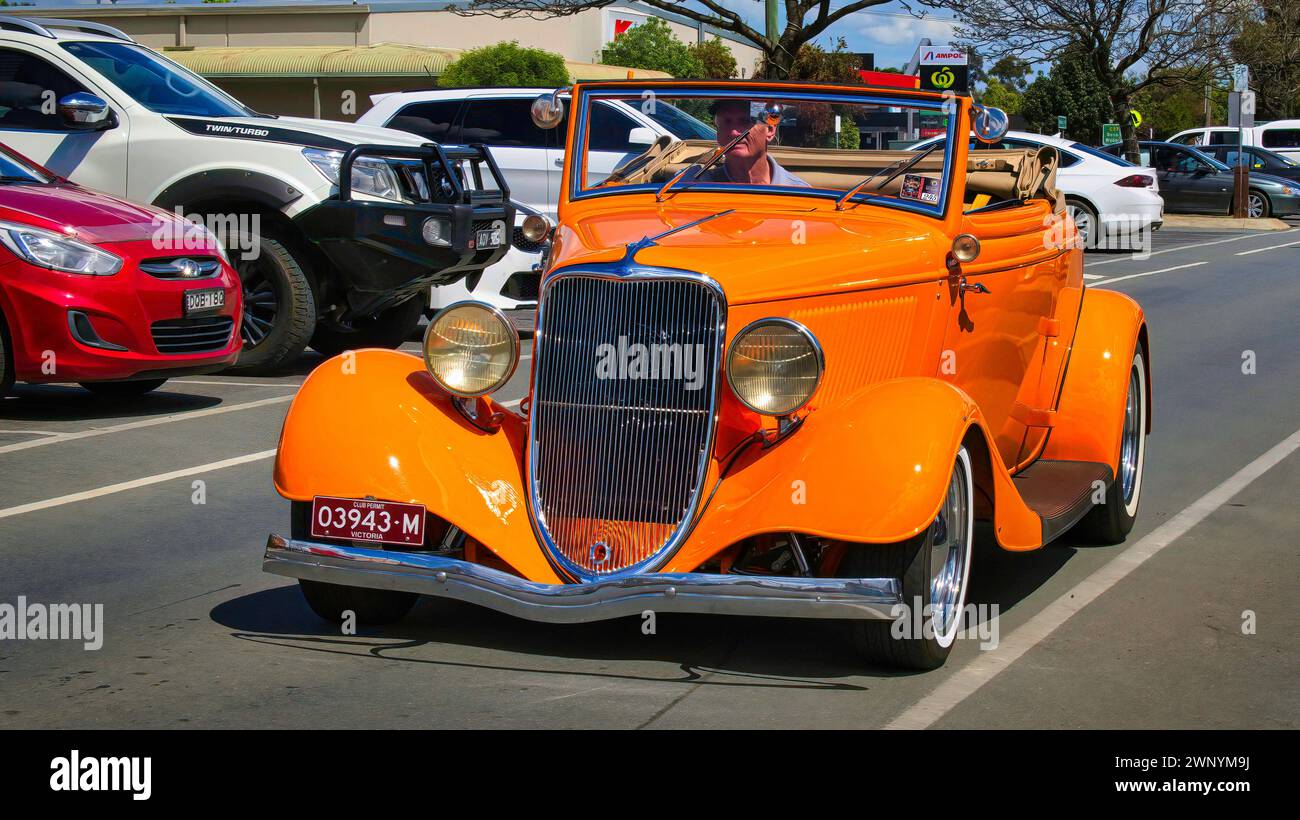 Yarrawonga, Victoria, Australia - 5 November 2022: Orange vintage classic stealing the show in the main street of Yarrawonga Stock Photo