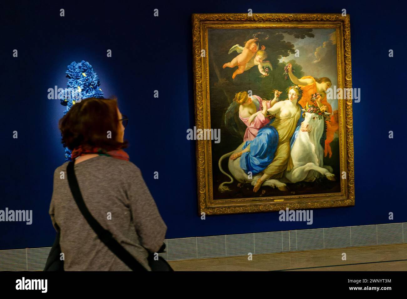 Madrid, Spain. 04th Mar, 2024. A woman observes the work 'The Abduction of Europe' at the Thyssen Museum during the demonstration. Femen Spain has carried out a protest action in front of the pictorial work 'The Abduction of Europe' by Simon Vouet, at the Thyssen Bornemisza Museum. They have denounced 'the culture of love' on the eve of a new 8M, International Women's Day. (Photo by David Canales/SOPA Images/Sipa USA) Credit: Sipa USA/Alamy Live News Stock Photo