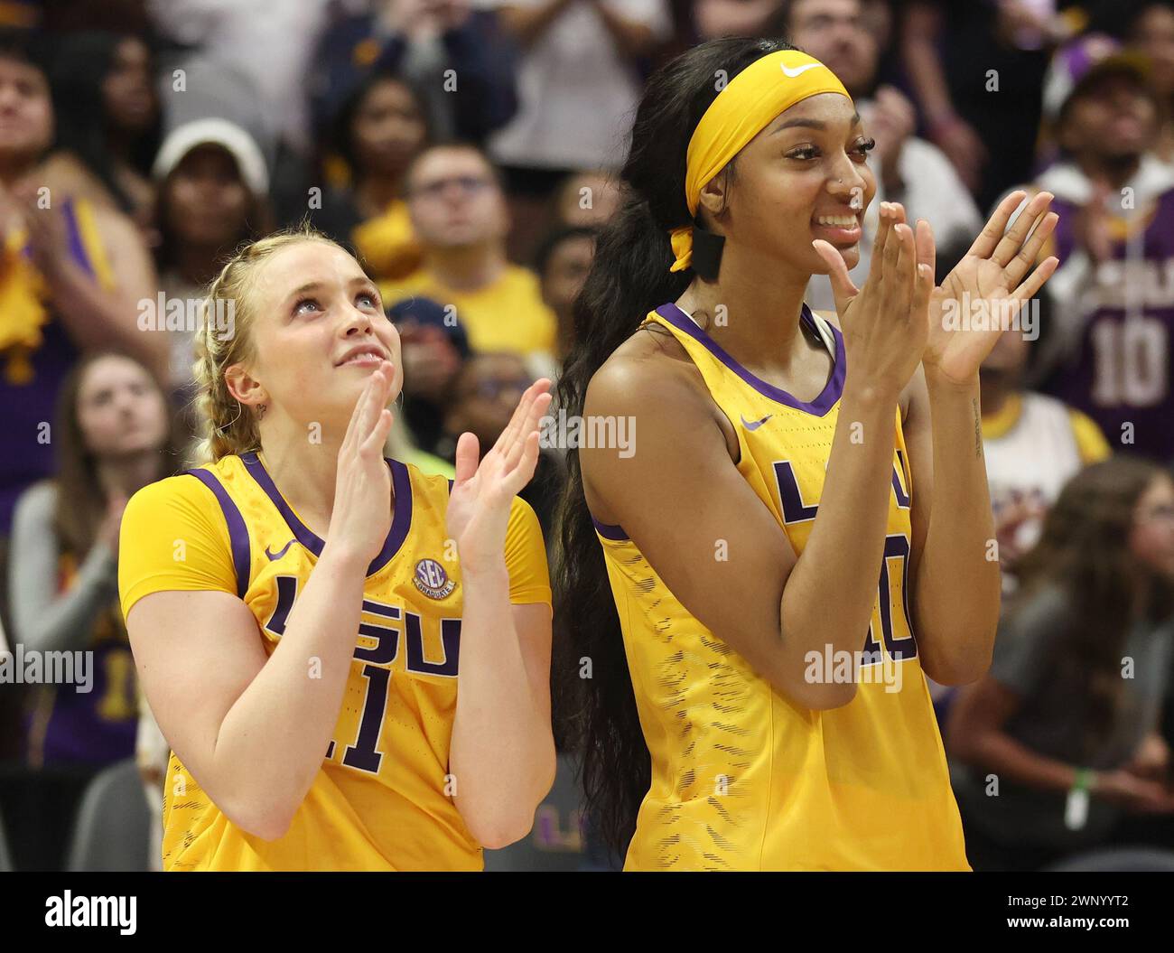 Baton Rouge, USA. 03rd Mar, 2024. LSU Lady Tigers guard Hailey Van Lith (11) and forward Angel Reese (10) both clap during a video tribute video viewing on Senior Night in the conclusion of a Southeastern Conference women's college basketball game at Pete Maravich Assembly Center in Baton Rouge, Louisiana on Sunday, March 3, 2023. Both Van Lith and Reese are featured in the video (Photo by Peter G. Forest/Sipa USA) Credit: Sipa USA/Alamy Live News Stock Photo