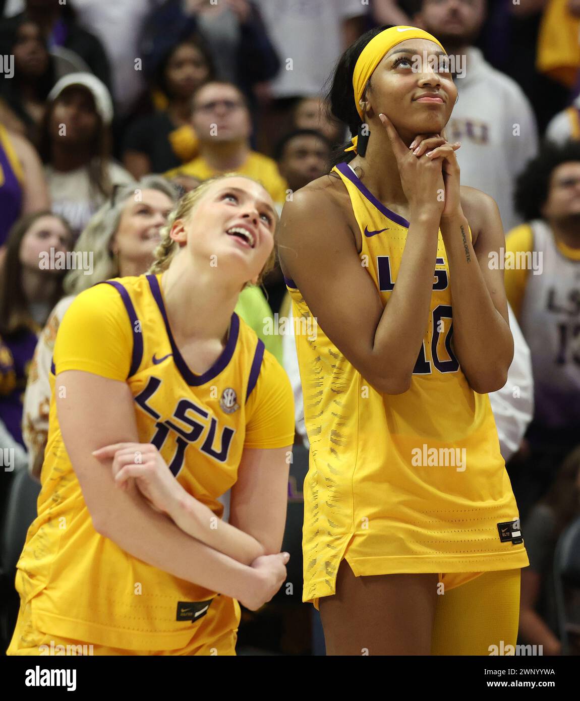 Baton Rouge, USA. 03rd Mar, 2024. LSU Lady Tigers guard Hailey Van Lith (11) and forward Angel Reese (10) both watch a video tribute of themselves on Senior Night in the conclusion of a Southeastern Conference women's college basketball game at Pete Maravich Assembly Center in Baton Rouge, Louisiana on Sunday, March 3, 2023. (Photo by Peter G. Forest/Sipa USA) Credit: Sipa USA/Alamy Live News Stock Photo