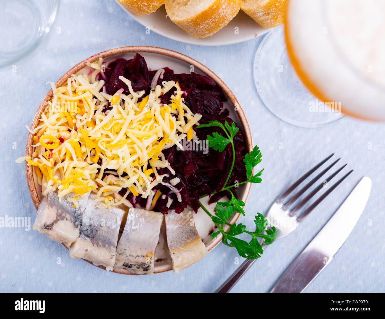 Beetroot served with cheese and pickled mackerel Stock Photo
