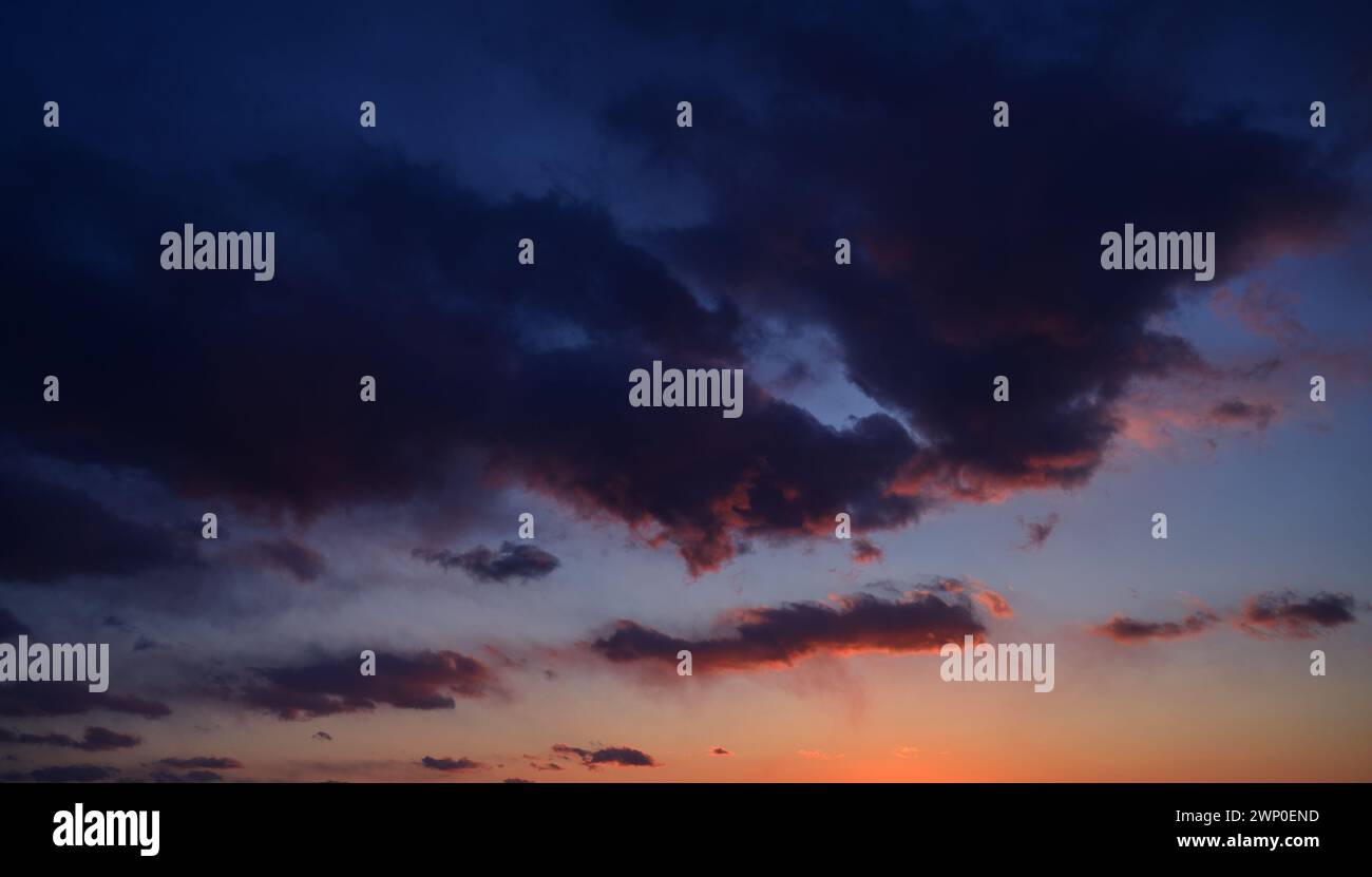 Sunset sky with orange clouds. Nature background Stock Photo - Alamy