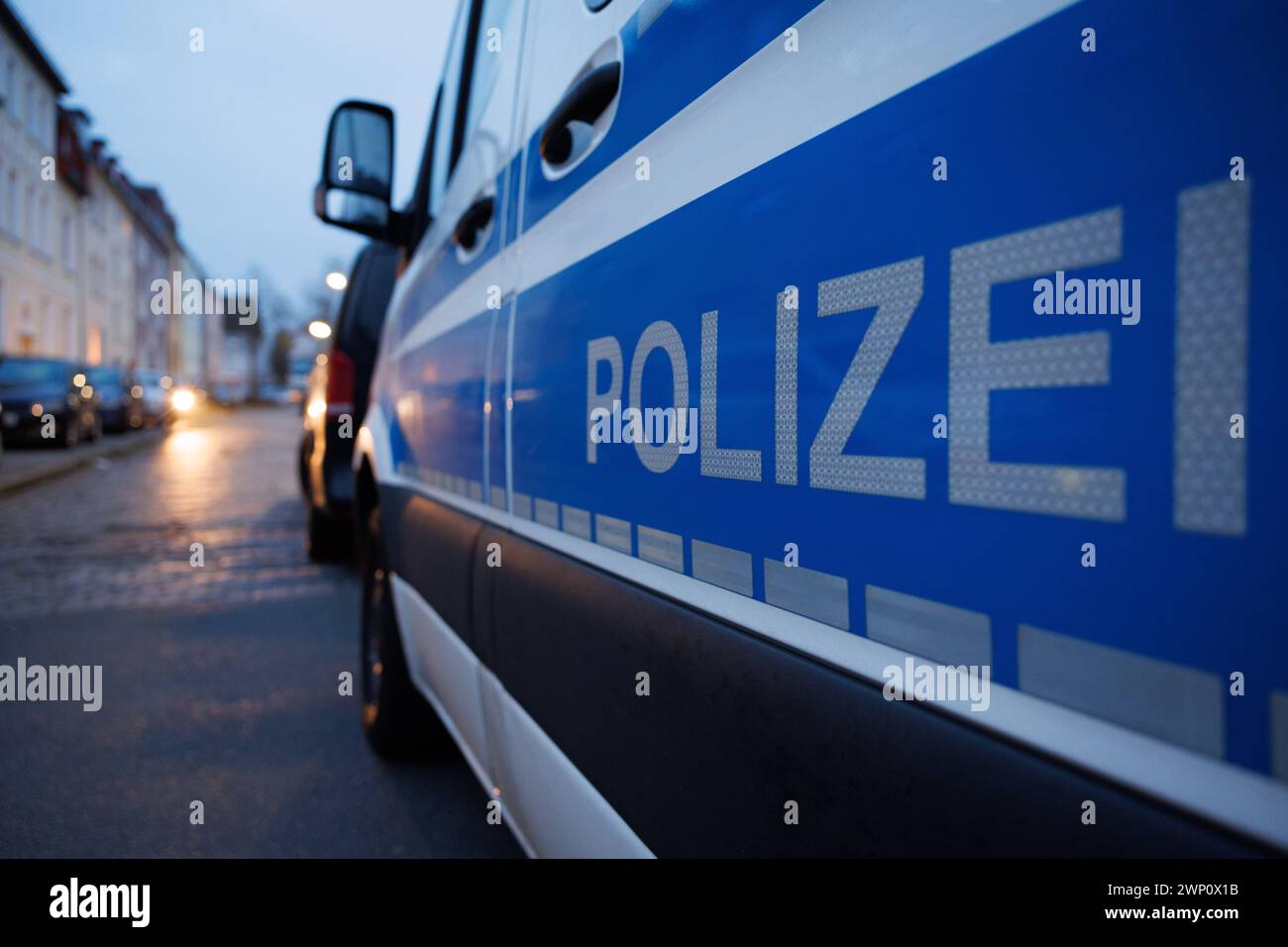 05 March 2024, Lower Saxony, Osnabrück: A police vehicle is parked on a street. Police have busted a professional indoor marijuana plantation with a large-scale drug raid in the northwest of Lower Saxony and in the greater Bielefeld area. Photo: Friso Gentsch/dpa Stock Photo