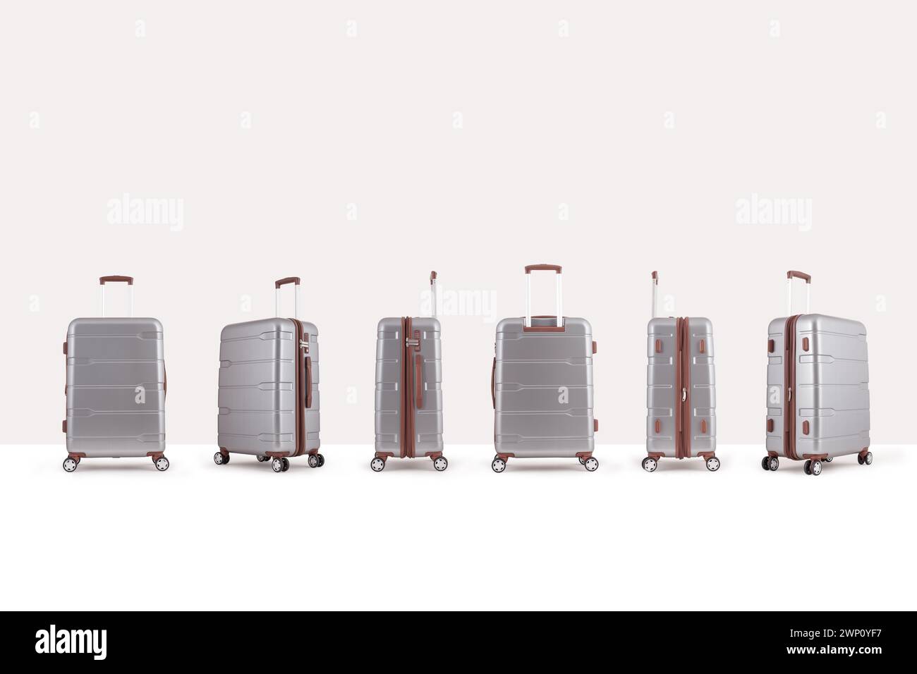 Gray plastic suitcase isolated on white background, group of vacation luggage in perspective view Stock Photo