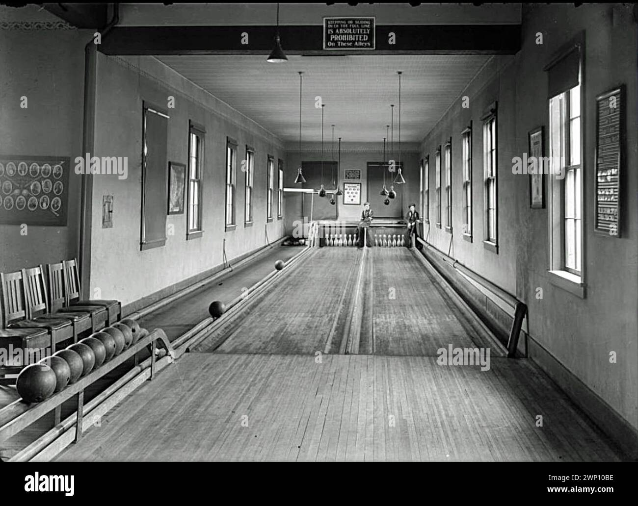 Two bowling lanes with two pinboys (human pinsetters), Colorado. Circa 1910 Stock Photo Alamy
