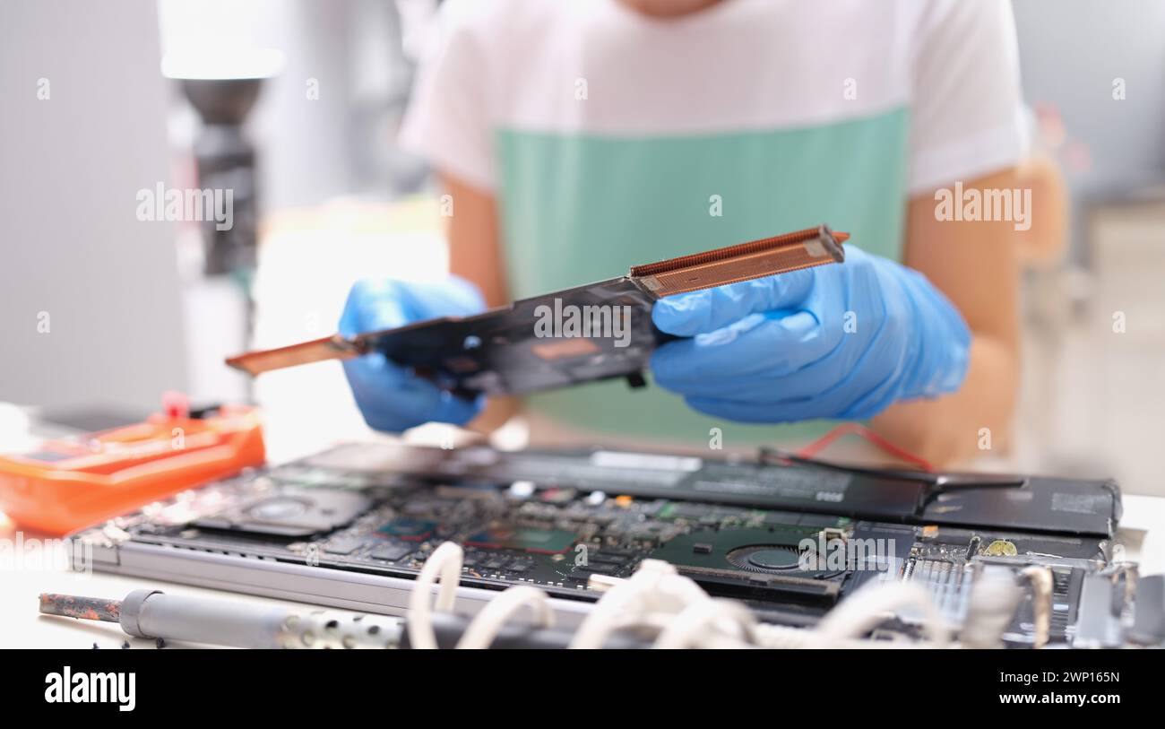 Technical engineer is working on computer motherboard Stock Photo - Alamy