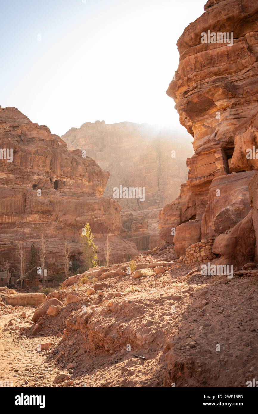 Beautiful View of Red Sandstone Rock Formations in Jordanian Petra. Geological Outdoor Nature in Jordan. Vertical Landscape of Stony Cliff Outdoors. Stock Photo