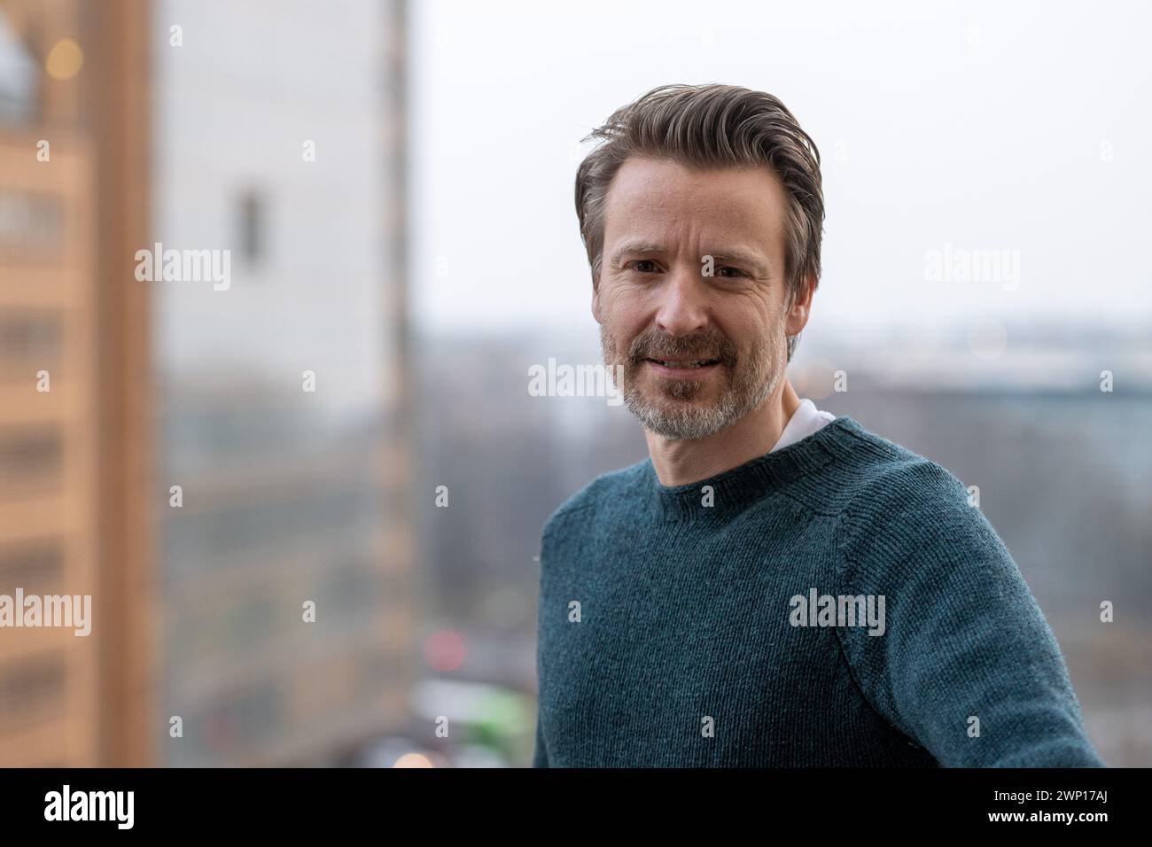 Berlin, Germany. 04th Mar, 2024. Max von Pufendorf, actor, stands on a balcony of the Komödie am Kurfürstendamm at Potsdamer Platz. Credit: Christophe Gateau/dpa/Alamy Live News Stock Photo