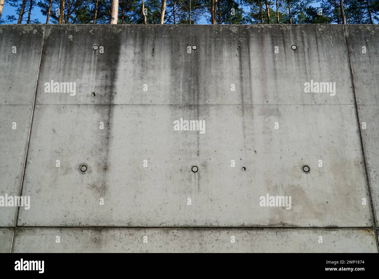 Concrete wall with round wholes Stock Photo