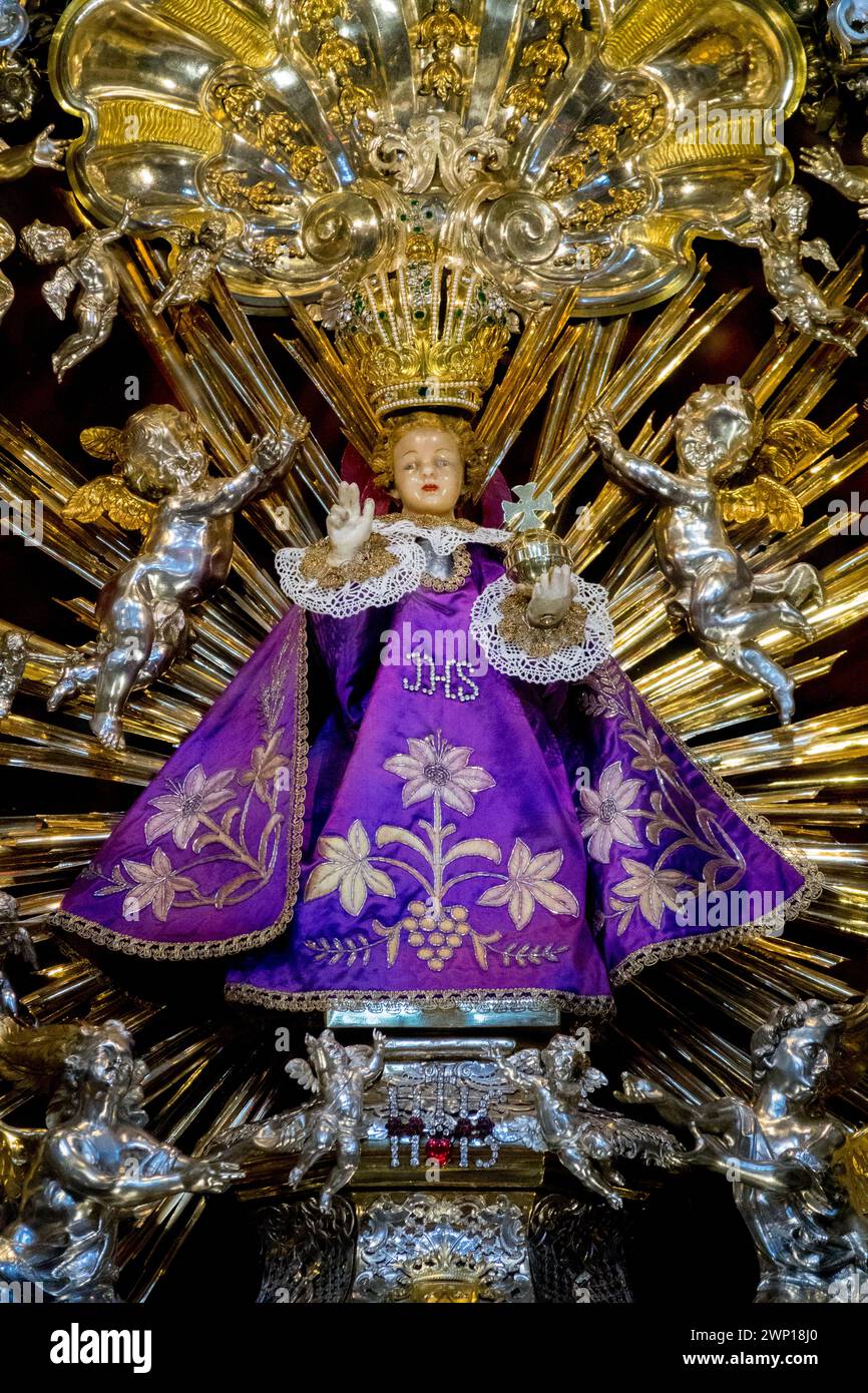 Statue of the Infant Jesus of Prague is located in the shrine, golden altar inside the Church of Our Lady Victorious Mala Strana Prague Czech Republic Stock Photo