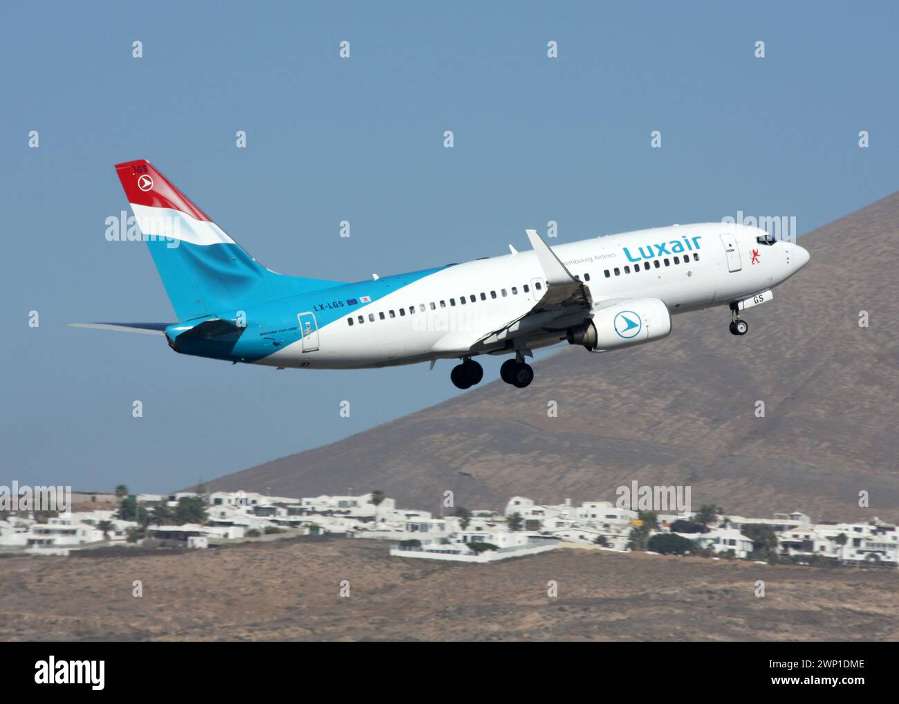 A Boeing 737-700 of Luxair departs Lanzarote Arrecife Airport Canary Islands Stock Photo