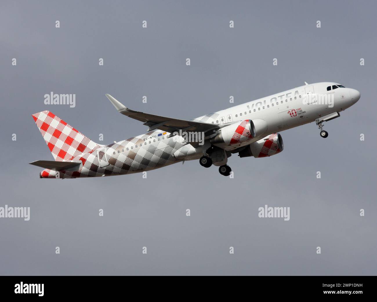 An Airbus A320 of Volotea in a special scheme marking 10 years of the airline departs Lanzarote Arrecife Airport Stock Photo