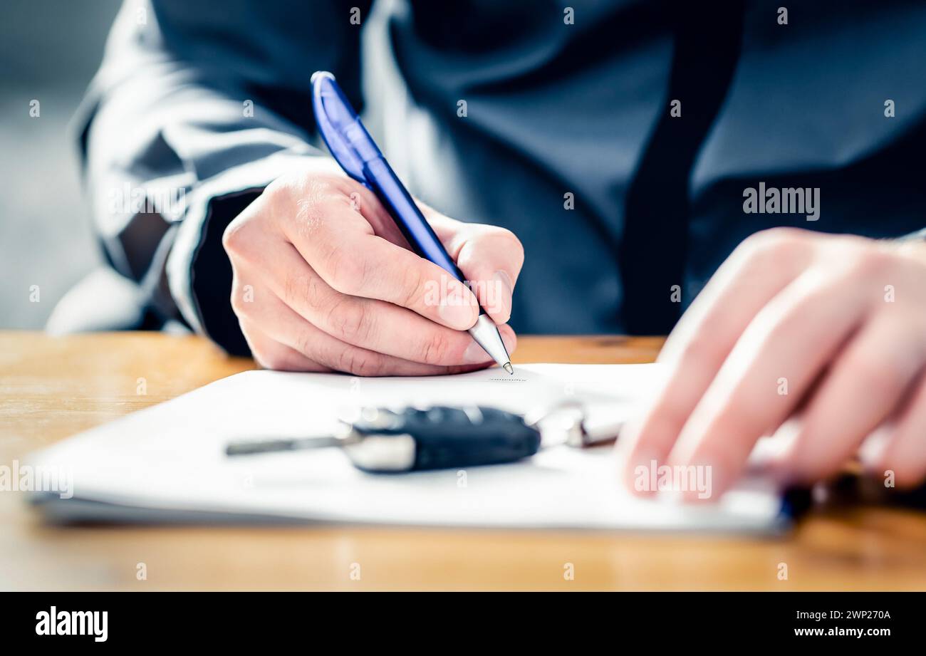 Car lease loan document. Auto finance or insurance paperwork. Sell, rent or buy used vehicle. Dealership company or rental agency contract policy. Stock Photo