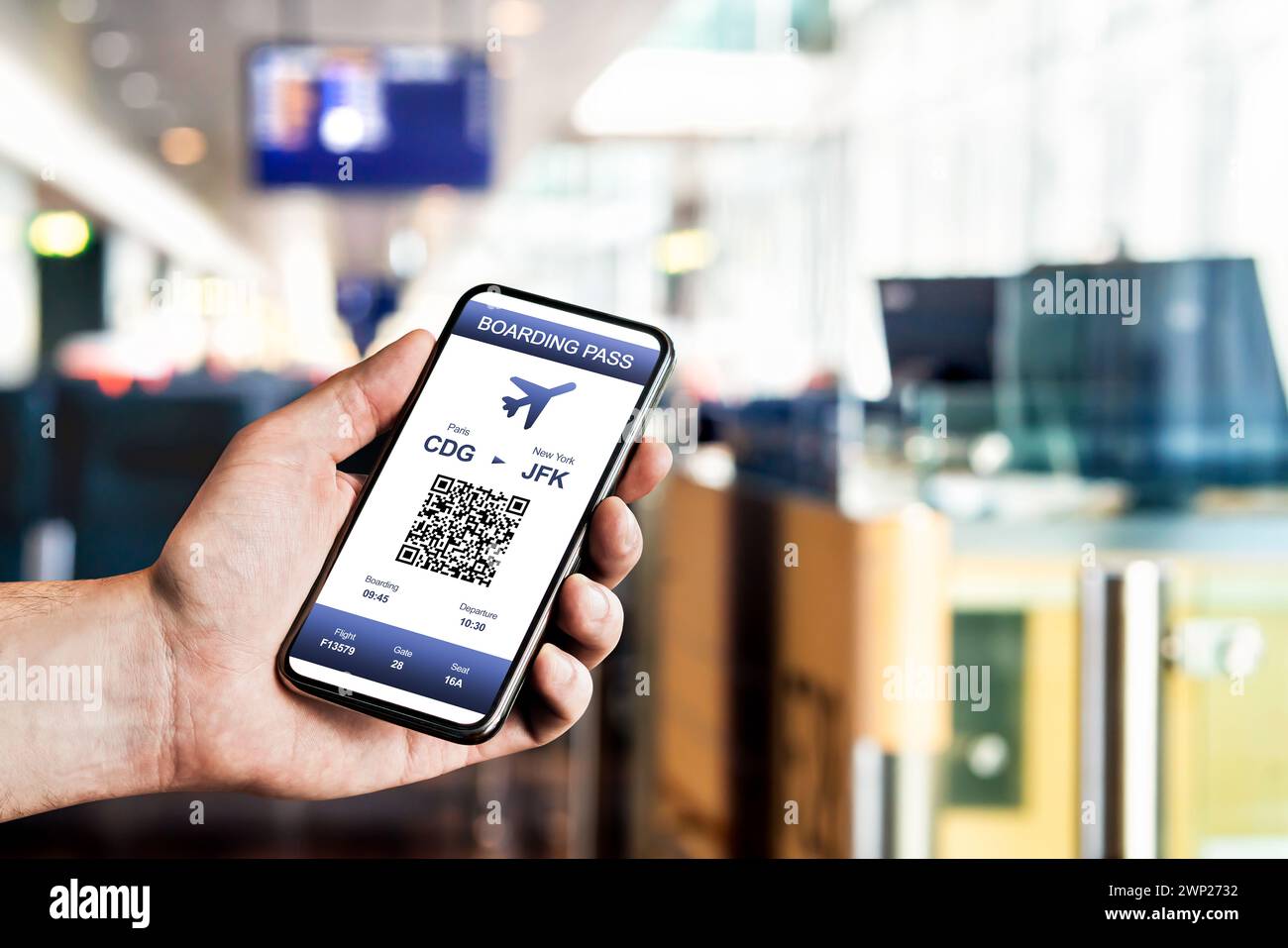 Boarding pass in phone at airport. Electronic flight ticket. Digital mobile app with QR code. Airplane travel with modern airline. Stock Photo