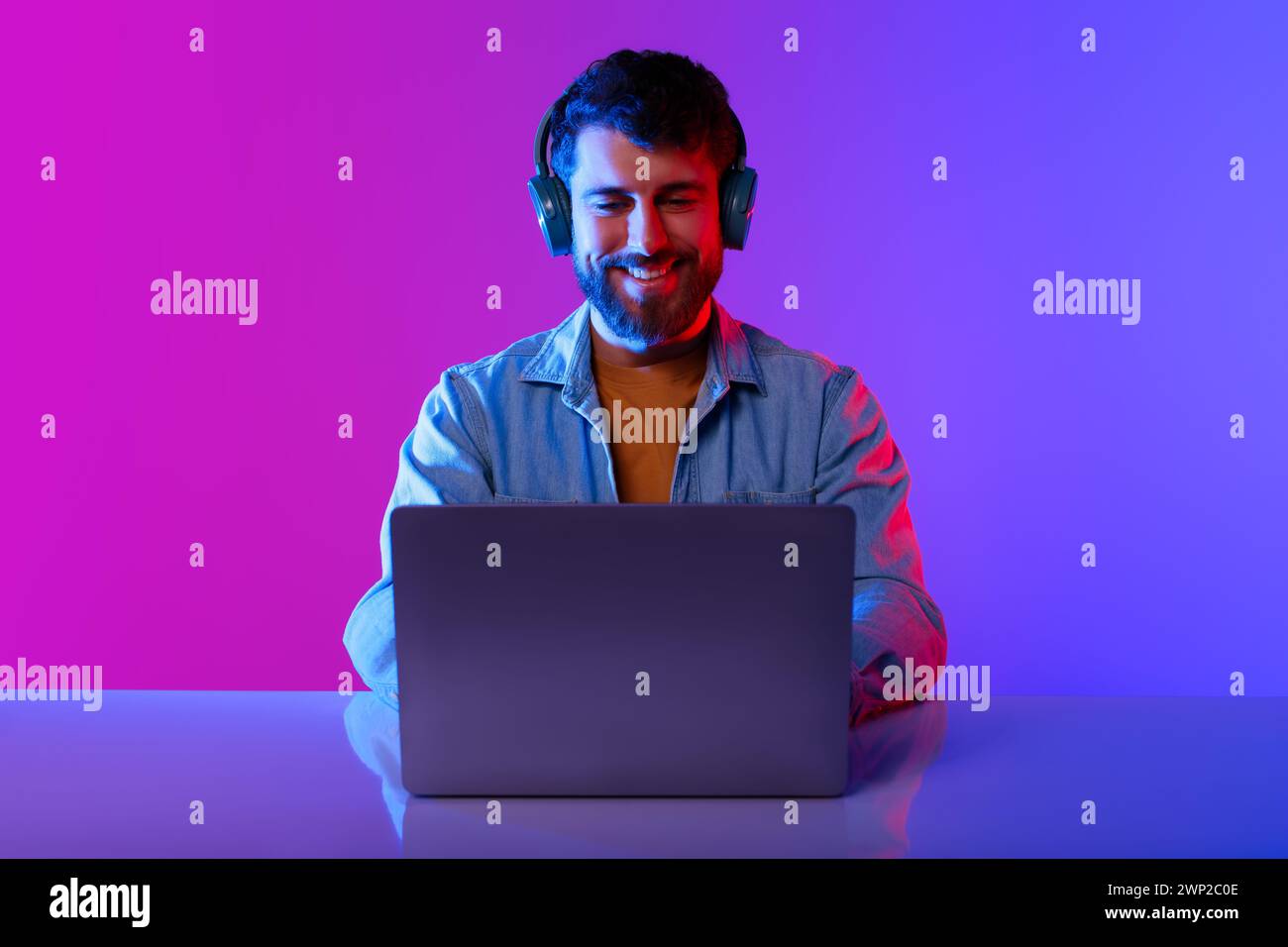 Honeguy Using Internet Happy Millennial Guy Wearing Headphones Browsing Internet On Laptop ...