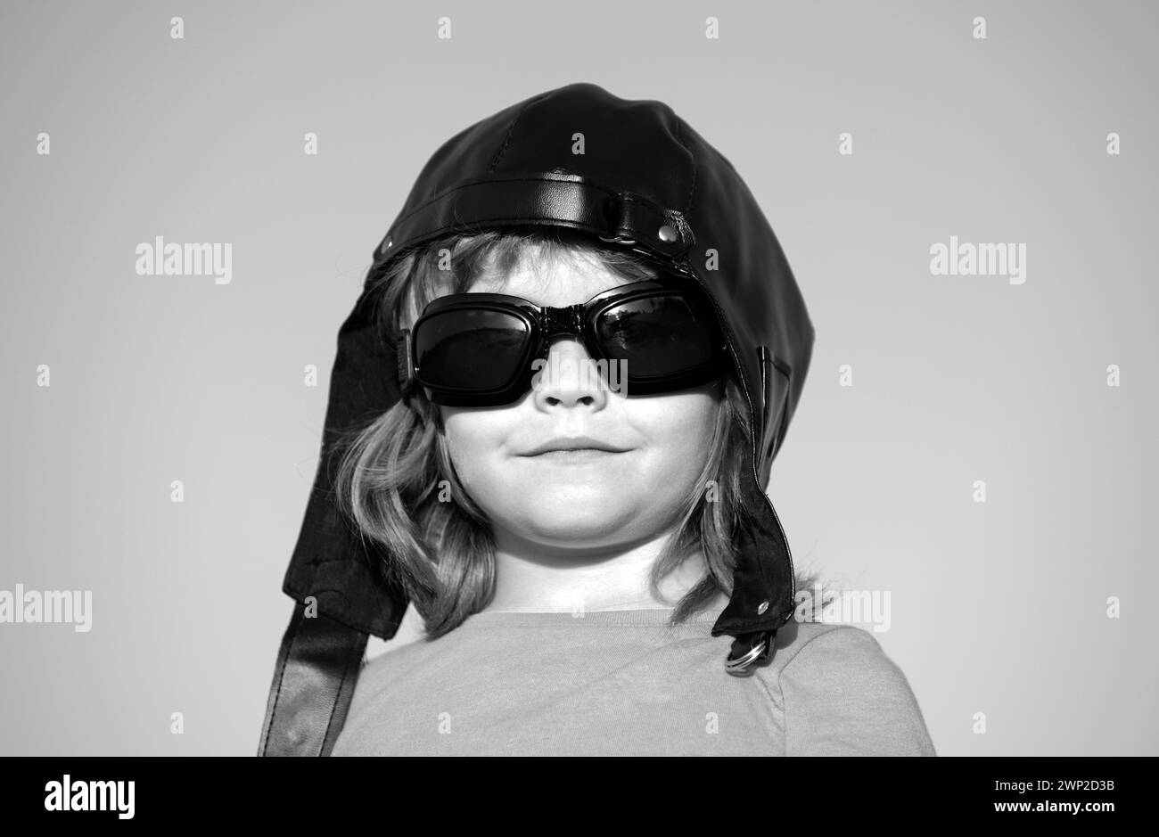 Kids dream. Caucasian child with pilot helmet and glasses, funny