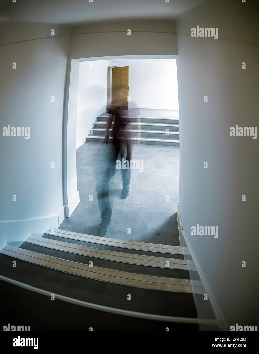 Blurred abstract image of a man moving through a corridor Stock Photo