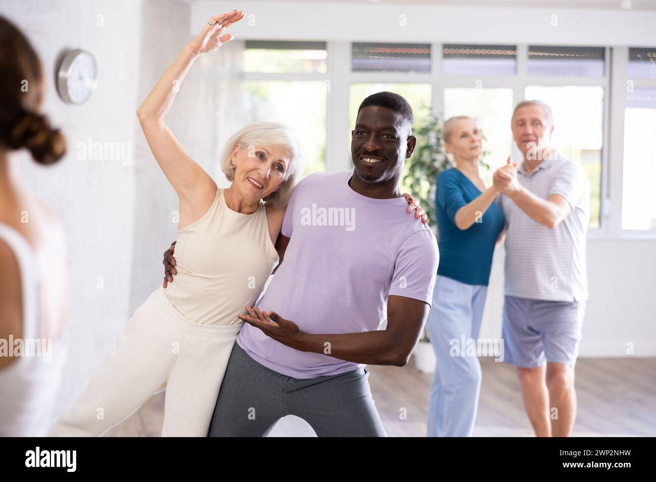 Elderly woman dancing merengue with african american partner Stock ...