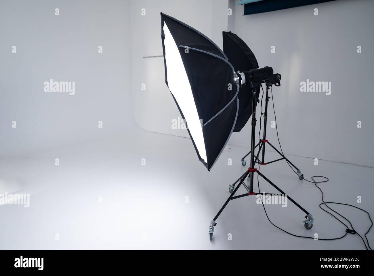 studio flashes on the background of a white cyclorama. Stock Photo