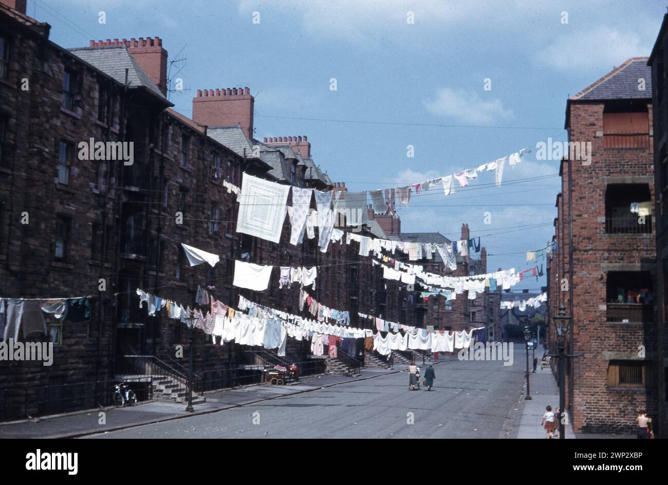 Washing strung across the street at Devonshire Buildings, Barrow Island, Barrow-in-Furness, England c1964   Photo by The Henshaw Archive Stock Photo