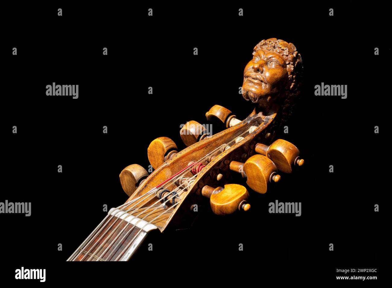Carved head of Bacchus on a seven-string tenor bass viol from the 17th century, Haus Kemnade castle, Hattingen, North Rhine-Westphalia, Germany, Europ Stock Photo