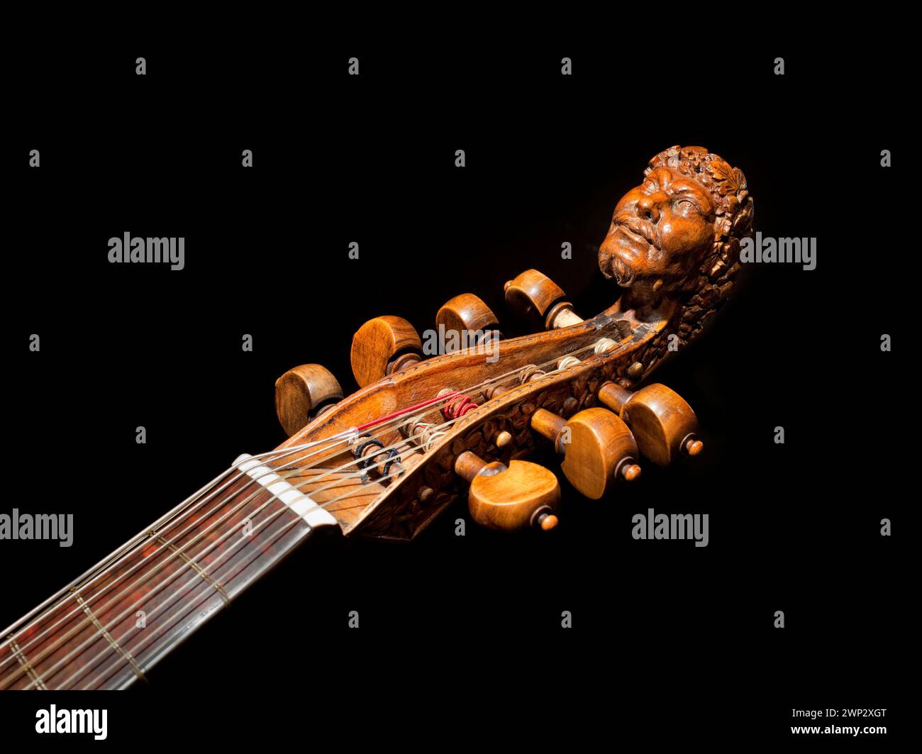 Carved head of Bacchus on a seven-string tenor bass viol from the 17th century, Haus Kemnade castle, Hattingen, North Rhine-Westphalia, Germany, Europ Stock Photo