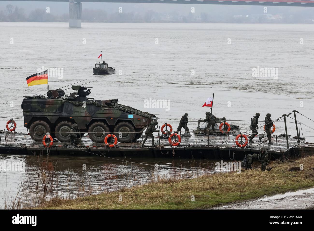 Korzeniewo, Pomorskie, Poland on March 5, 2024. German servicemen present transfer of tanks and armored vehicles via Vistula river during NATO's Dragon-24 exercise, a part of large scale Steadfast Defender-24 exercise. The exercises, which take place mainly in Central Europe, involve some 90,000 troops from all NATO countries as well as Sweden. The aim of Steadfast Defender-24 is to deter and present defensive abilities in the face of aggression. Credit: Dominika Zarzycka/Alamy Live News Stock Photo