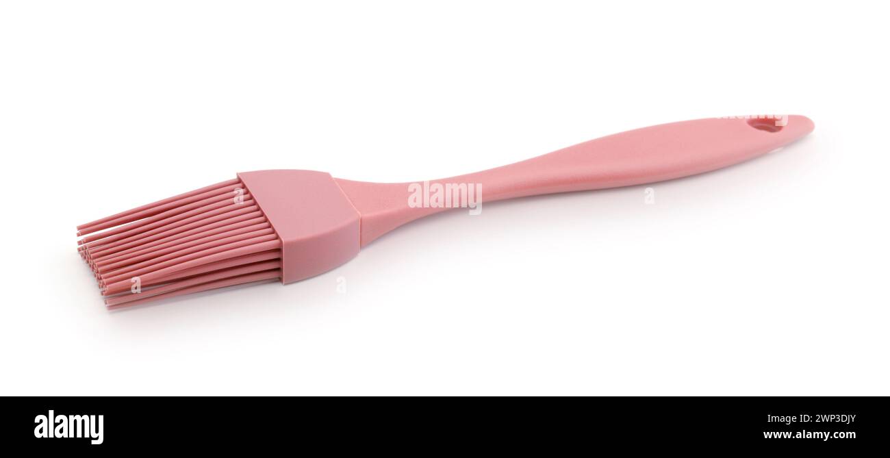 New silicone kitchen brush isolated on white. Stock Photo