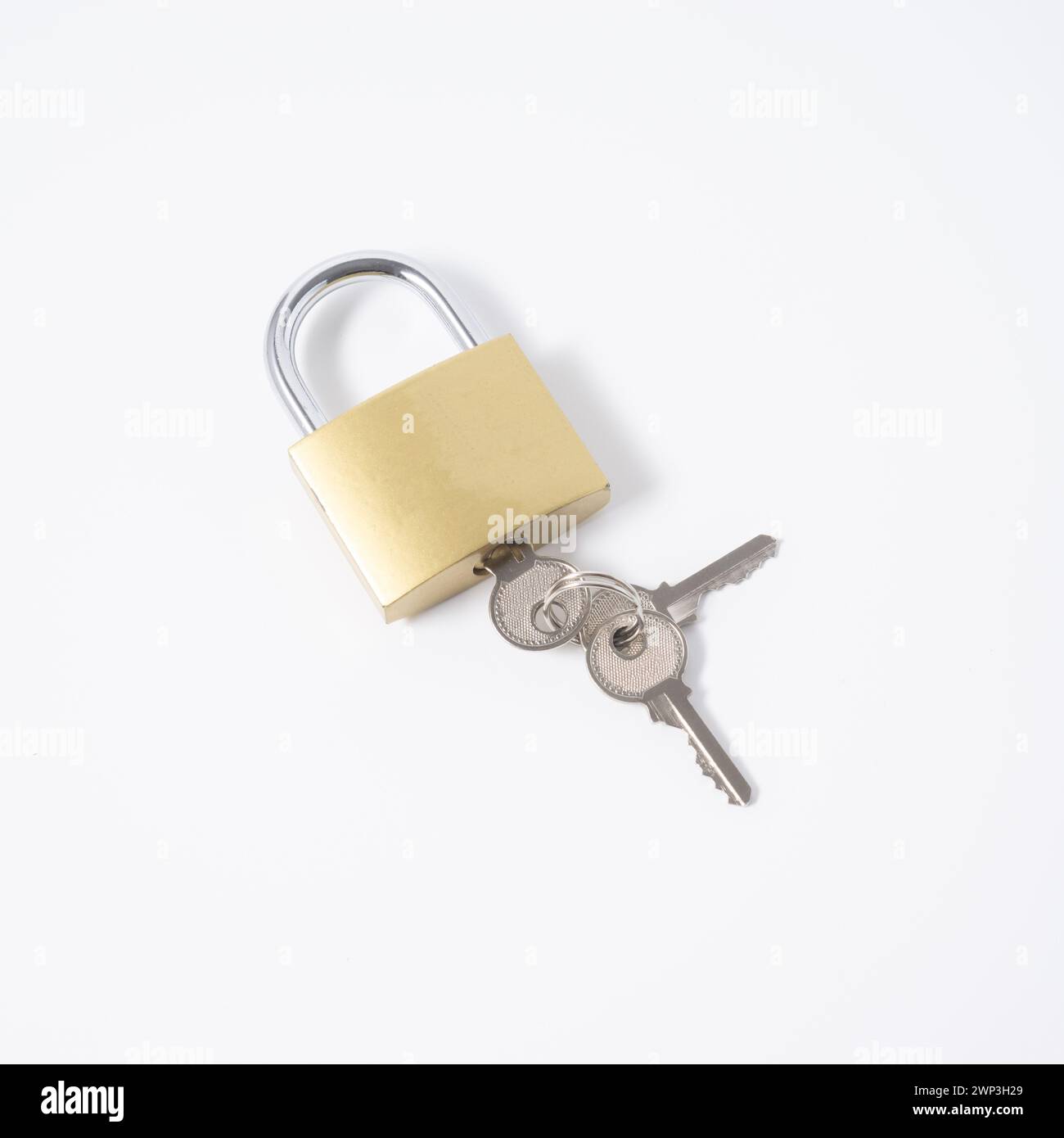 Golden padlock with a key isolated on white background Stock Photo - Alamy