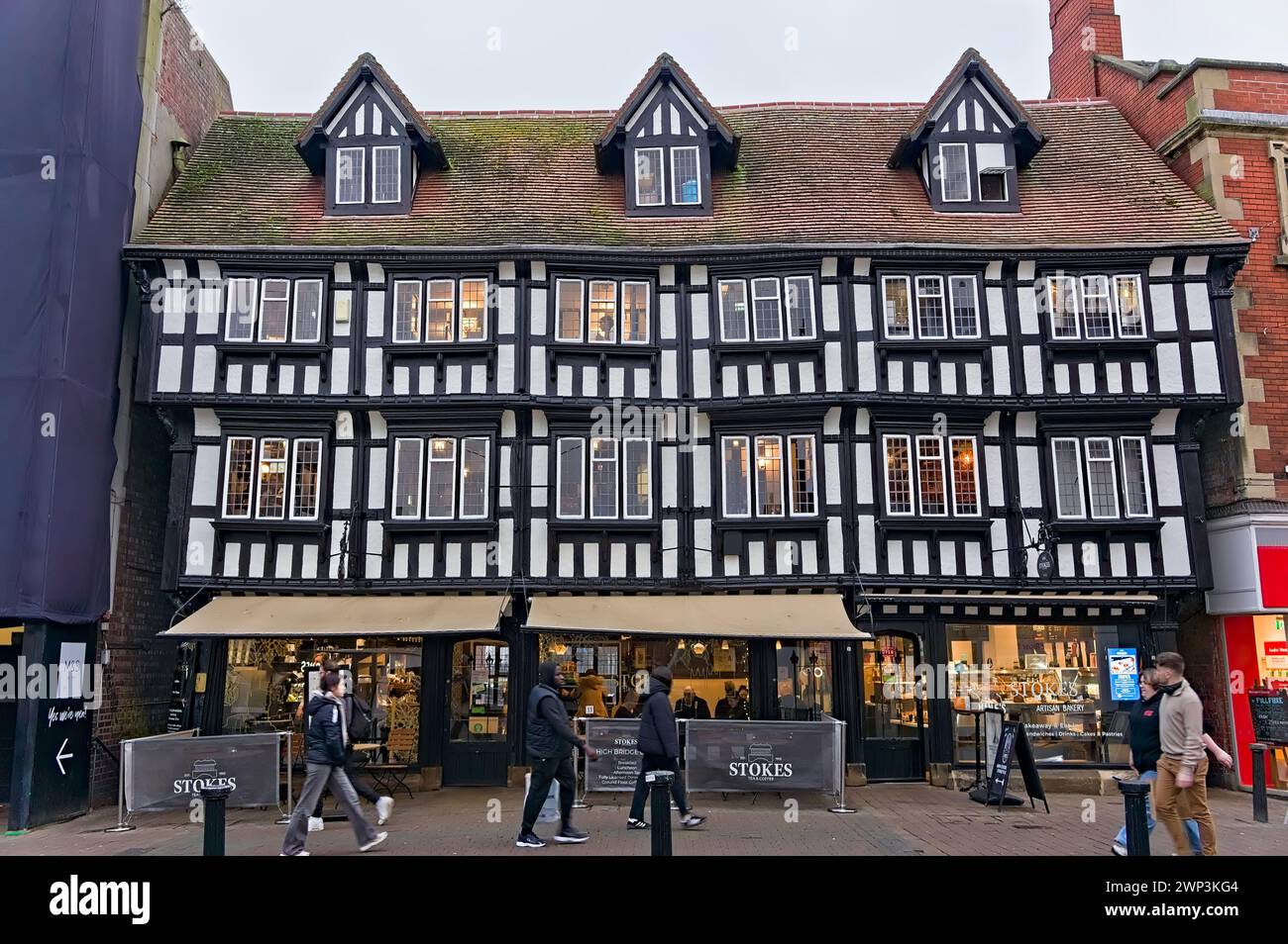 The medieval wood-framed building housing the STOKES restaurant on the High Bridge in the city centre Stock Photo