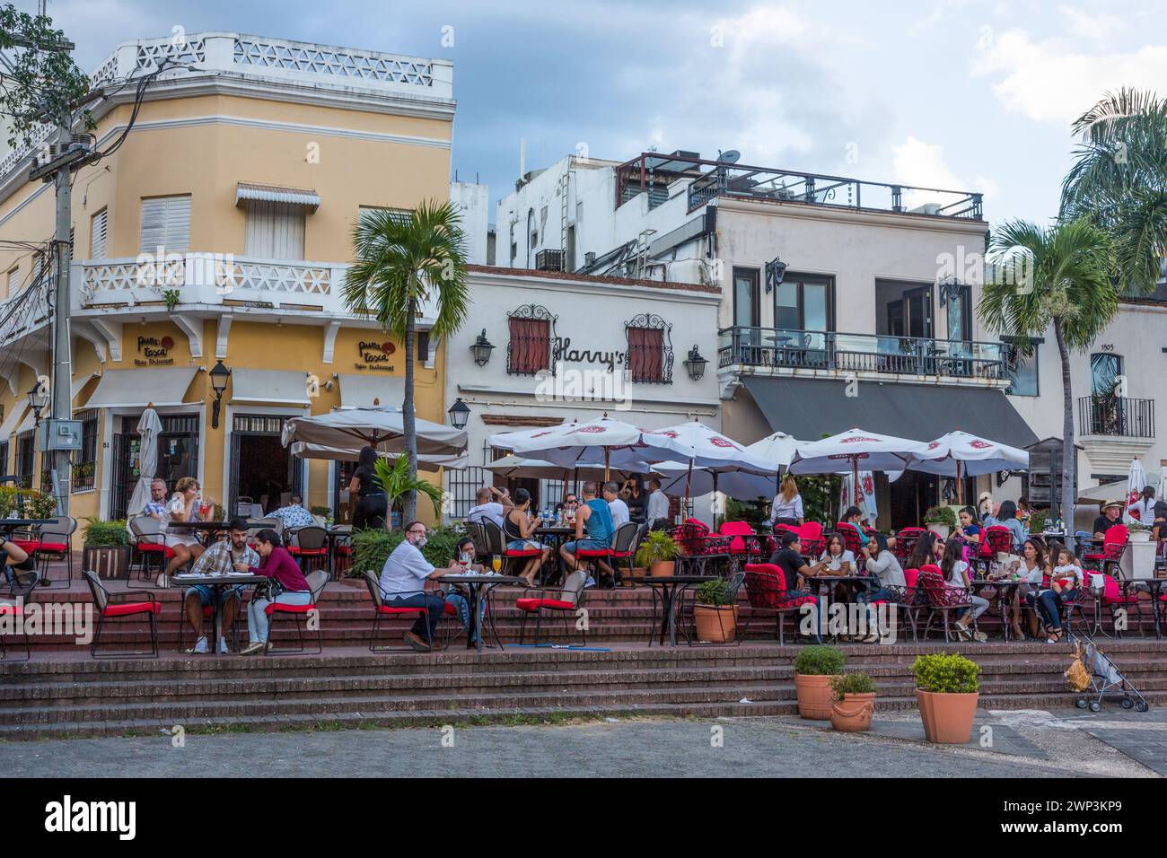 Tourists eating dinner in open air restaurants on the Spanish Plaza in the Colonial City of