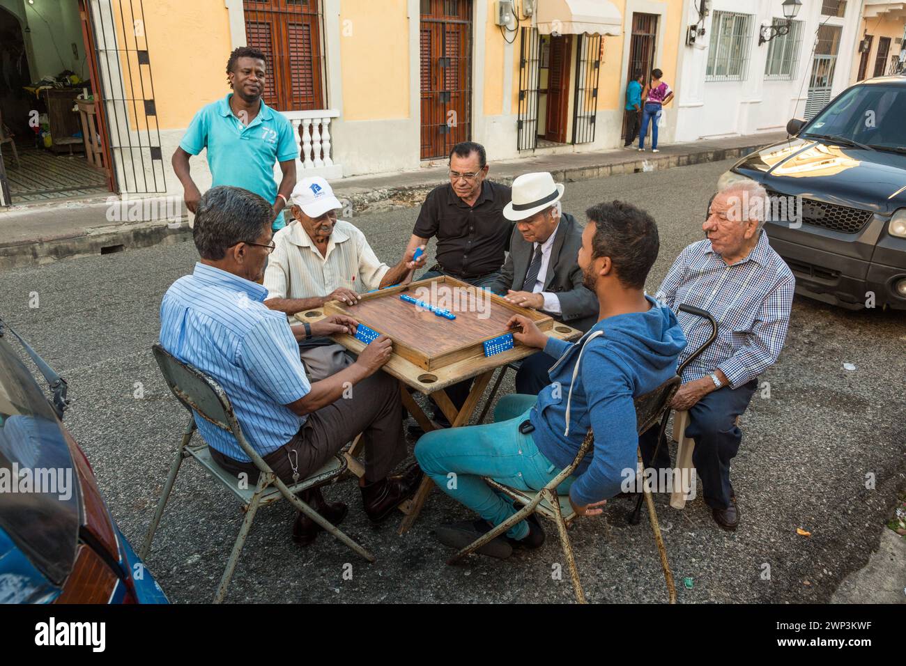 Dominican men playing dominoes on the in the street in the old Colonial