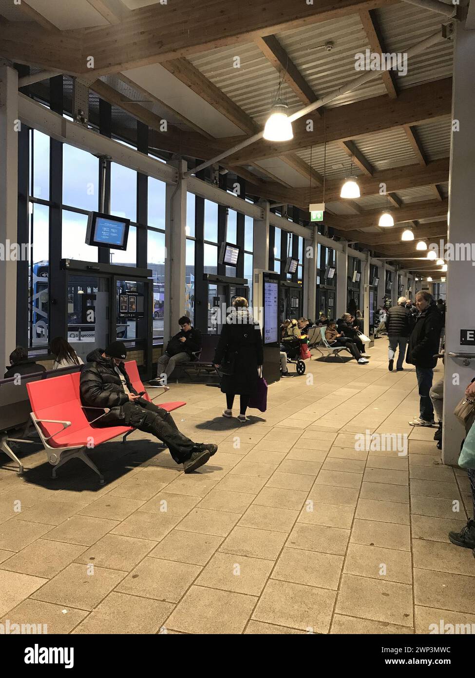 People waiting Inside the new central bus station Stock Photo