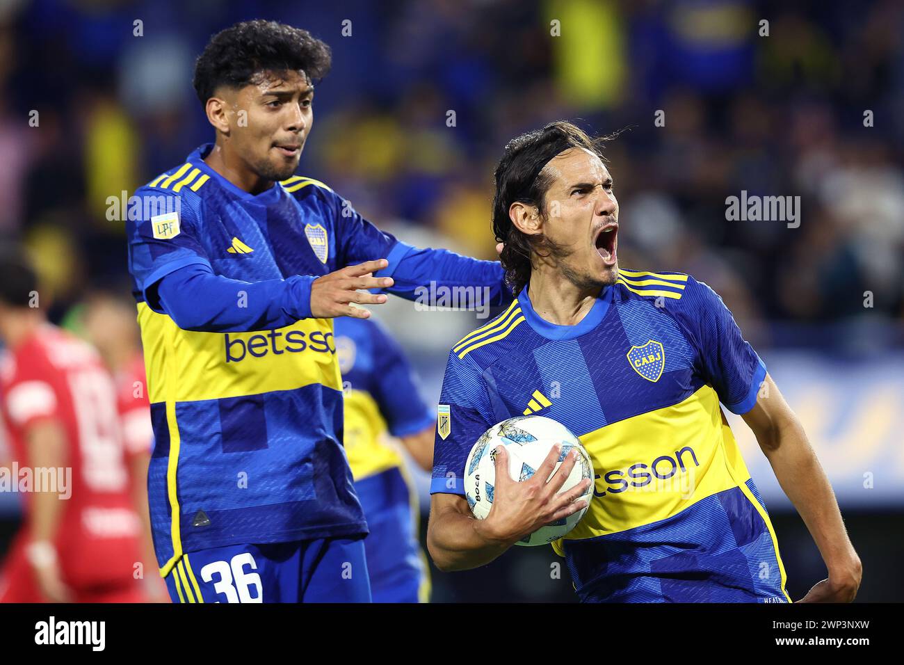 Boca Juniors’ Uruguayan Edinson Cavani (R) celebrates next teammate midfielder Cristian Medina after scoring the team’s first goal by penalty kick against Belgrano during the Argentine Professional Football League Cup 2024 match at La Bombonera stadium in Buenos Aires on March 3, 2024.    Boca Juniors won by 3-2 and Cavani scored a hat-trick. (Photo by Alejandro Pagni / PHOTOxPHOTO) Stock Photo