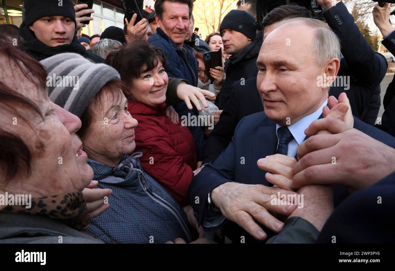 Solnechnodolsk, Russia. 05th Mar, 2024. Russian President Vladimir Putin, right, greets residents following a tour of the Solnechny Dar greenhouses, March 5, 2024 in Solnechnodolsk, Stavropol Territory, Russia. Credit: Mikhail Metzel/Kremlin Pool/Alamy Live News Stock Photo