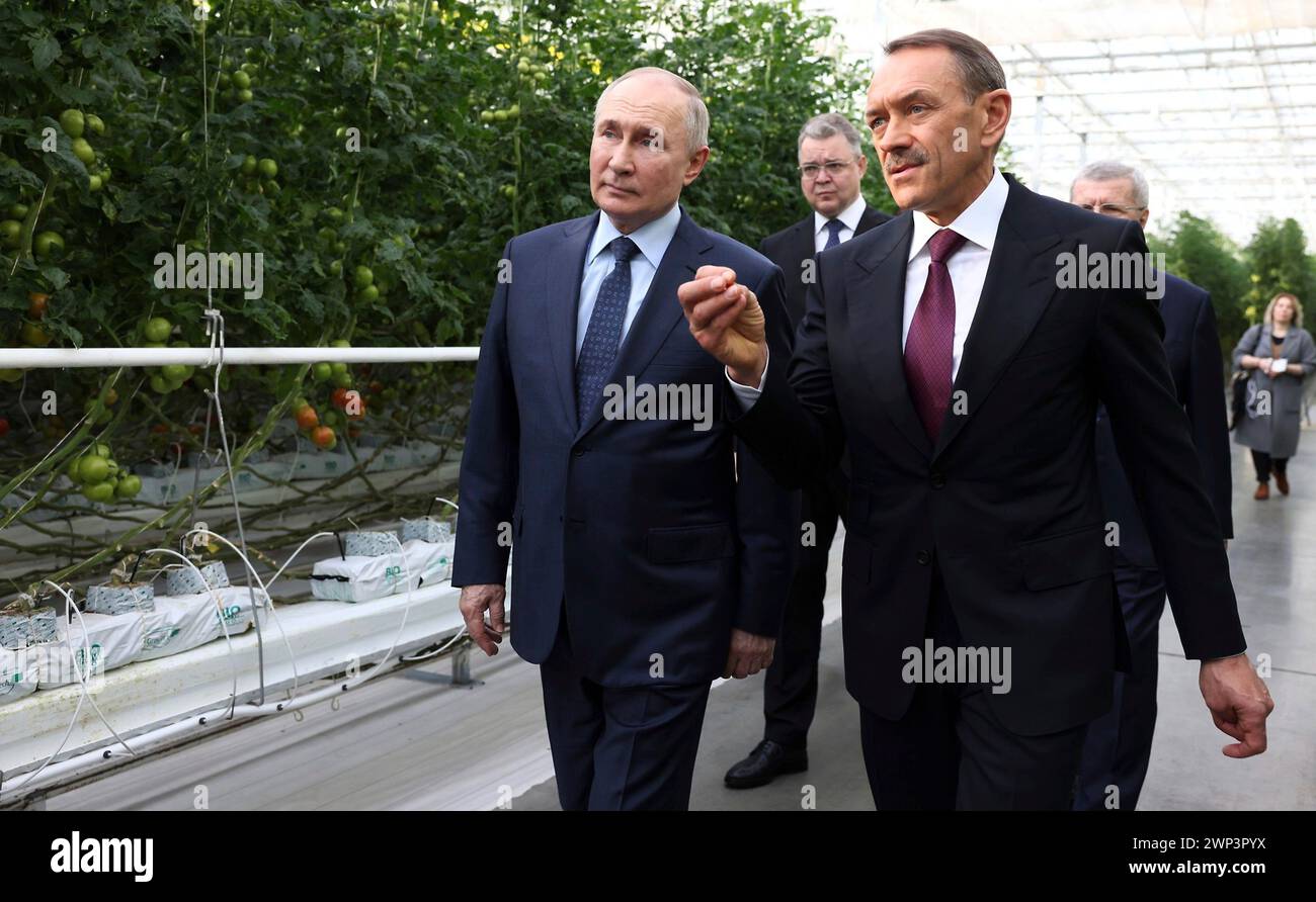 Solnechnodolsk, Russia. 05th Mar, 2024. Russian President Vladimir Putin, left, accompanied by Chairman of the ECO-Culture Agro-Industrial Holdings Alexander Rudakov, right, tours the robotic Solnechny Dar greenhouses for tomato cultivation, March 5, 2024 in Solnechnodolsk, Stavropol Territory, Russia. Credit: Mikhail Metzel/Kremlin Pool/Alamy Live News Stock Photo