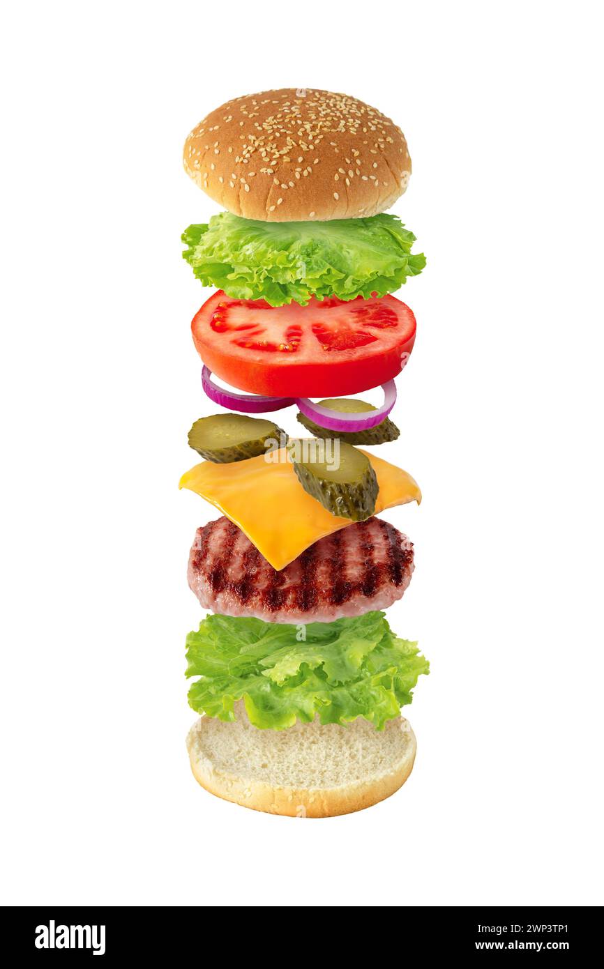 Hamburger with patty of ground beef meat, cheese, lettuce, tomato, onion,  pickles and bun with sesame seeds. Burger recipe concept. Tasty colorful sa Stock Photo