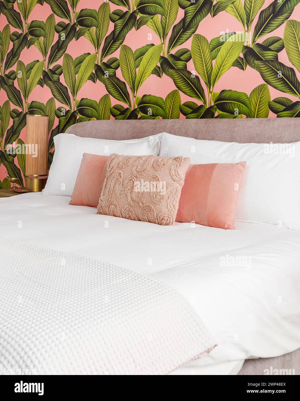 Bedroom with pink and green accent colors and tropical wallpaper theme ...