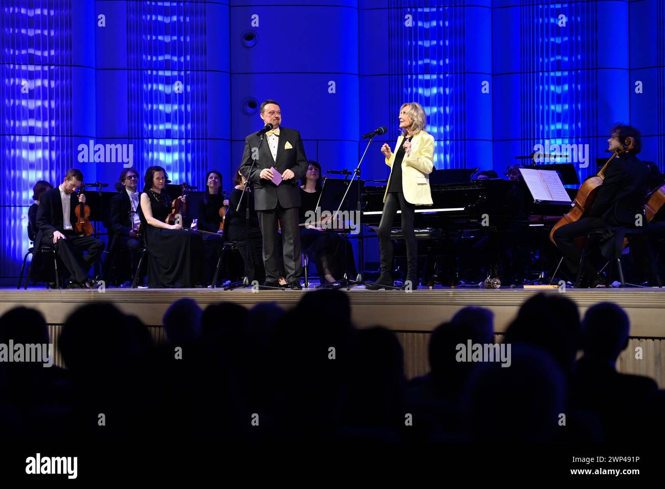 Zlin, Czech Republic. 05th Mar, 2024. The Zlin Bohuslav Martinu Philharmonic Orchestra has prepared a concert in honour of architect and Zlin native Eva Jiricna (right) on the occasion of her 85th birthday and naming of hall of the Zlin Congress Centre take place in Zlin, on March 5, 2024. Jiricna is author of the centre and other buildings in Zlin. On the left is the moderator Lubos Dostal. Credit: Dalibor Gluck/CTK Photo/Alamy Live News Stock Photo