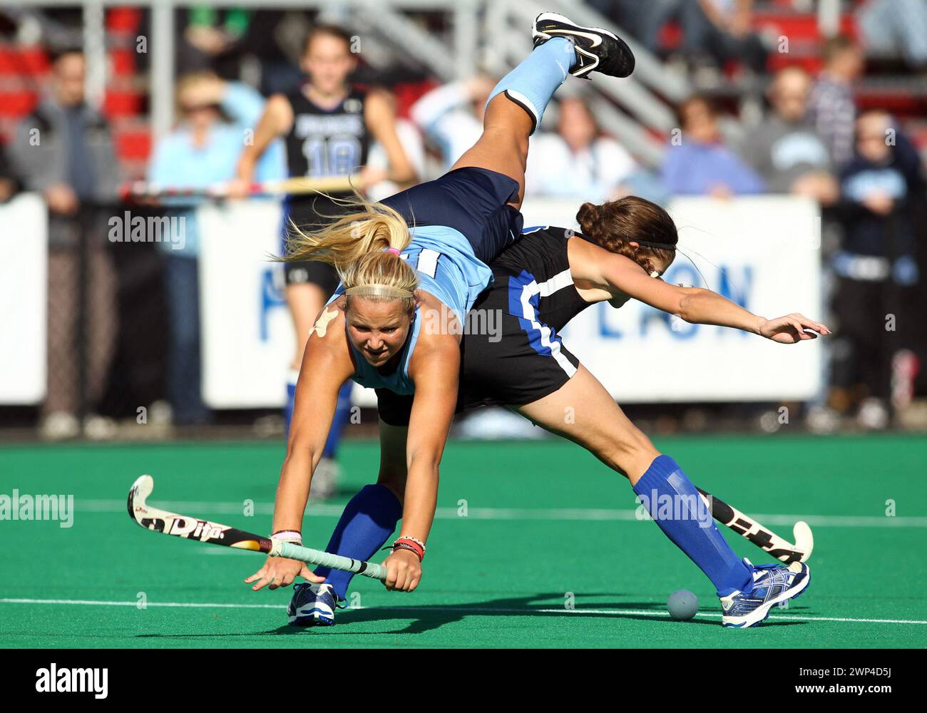 November 06 2011:Kelsey Kolojejchick (14) of North Carolina University takes a tumble over Paula Heimbach (2) of Duke university during the final of t Stock Photo