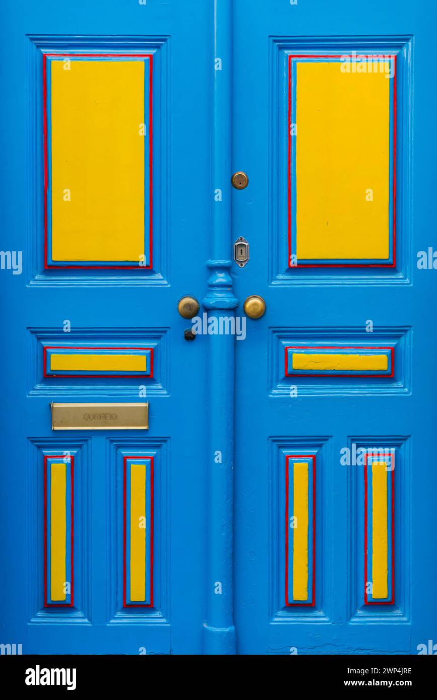 Typical colourful front door in Alfama, yellow, blue, lacquer