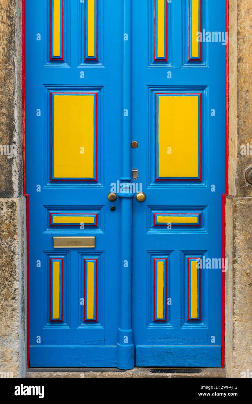 Typical colourful front door in Alfama, yellow, blue, lacquer