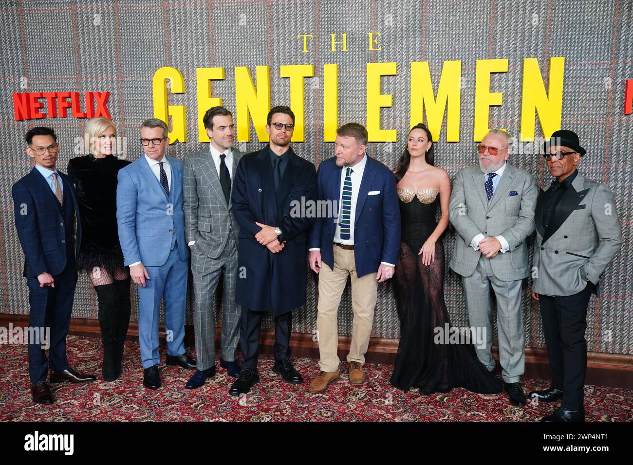 (left to right) Michael Vu, Joely Richardson, Max Beesley, Daniel Ings, Theo James, Guy Ritchie, Kaya Scodelario, Ray Winstone, and Giancarlo Esposito attend the premiere of the Netflix series The Gentlemen at the Theatre Royal Drury Lane, London.Picture date: Tuesday March 5, 2024. Stock Photo