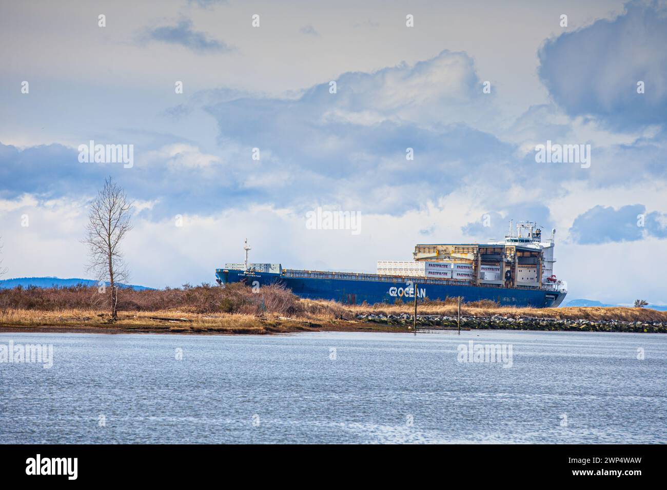 Cargo ship Star Juventas entering the Fraser River estuary at Steveston in Canada Stock Photo